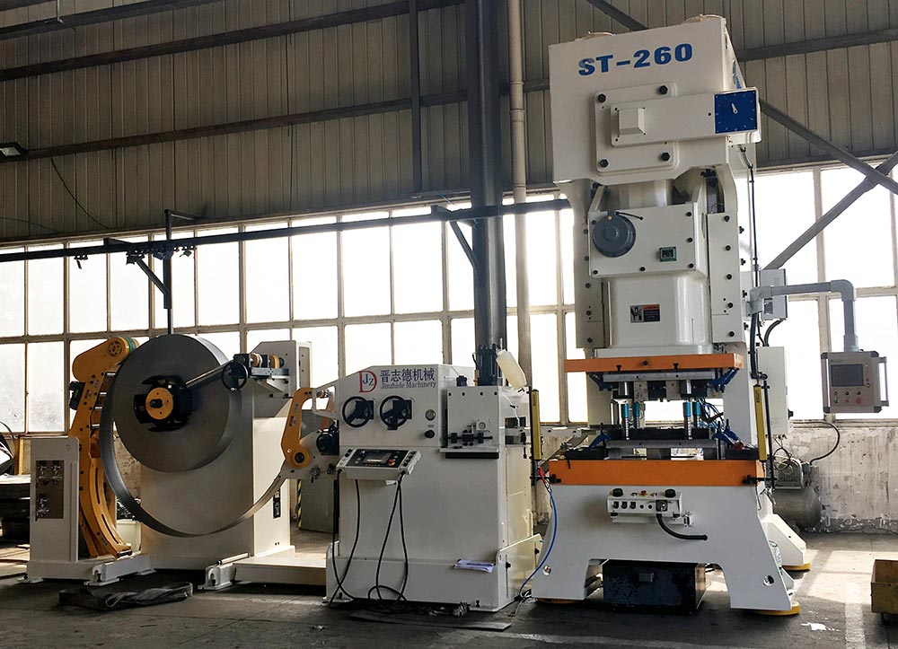 三合一送料機(jī)應(yīng)用,汽車減震器彈簧底座沖壓